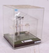 A 20th century acrylic cased architect model of a plumbing system in a modern house ( see
