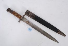A 1935 Pattern British army rifle bayonet with wooden handle being complete with the original
