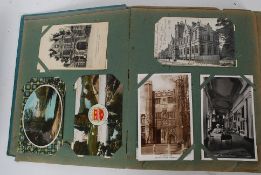 An Edwardian postcard album, filled with postcards - mostly topographical, but also some others.