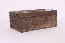 An early 20th century black forest carved wooden table top cigarette box bearing the national