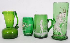 A collection of Mary Gregory style glass with overlaid painted designs to include beaker, goat jug,