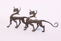 Two antique bronze temple dogs / dragons.