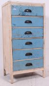 A vintage 1950's painted two tone upright pedestal chest of drawers with original half moon handles.