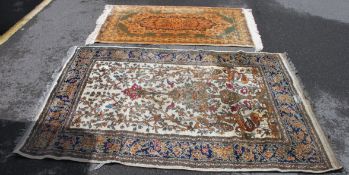 2 Persian style rugs with geometric patterns, one having a yellow ground,