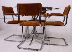 A rare 1970's chrome and smoked glass octagonal dining table and 4 cantilever dining chairs.