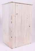 A 20th century vintage painted pine shabby chic cupboard having slatted door with flared top above.