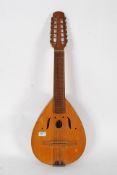 A 12 string Bandurria by Jose Roca of Valencia Spain having makers label to centre