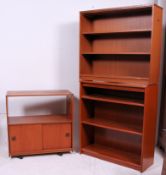 A collection of teak retro furnishings to include a teak trolley,
