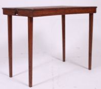 An unusual Edwardian oak inlaid table - tray raised on tapered supports bearing the original