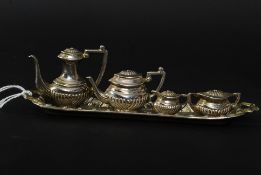 A miniature silver metal tea service complete with serving tray.