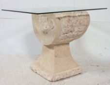 A contemporary marble lined and glass art sculpture side table.