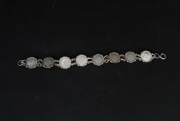 A silver ladies coin bracelet inset with 8 3 pence pieces  dating to the 1920's eta,