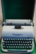 A vintage Remington typewriter complete with the case