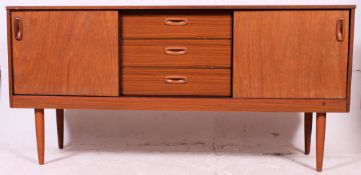A retro 1970's teak veneer low sideboard dresser raised on tapered supports comprising cupboard and