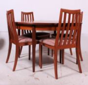 A 1970's Chester pattern G-Plan circular teak wood coffee table raised on tapered supports having a