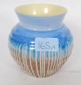 A 1930's Art Deco Shelley drip glaze vase being marked to the base ( see illustration )
