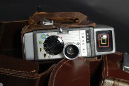 A collection of three vintage cine cameras to include a Bell & Howell Sun Dial, Autoset and another.
