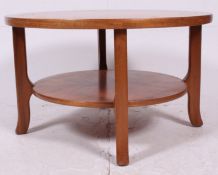 A retro 1970's teak wood Danish inspired circular coffee table having a reeded geometric pattern to