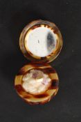 A 20th century tortoiseshell ladies pill box of circular form with hinged top