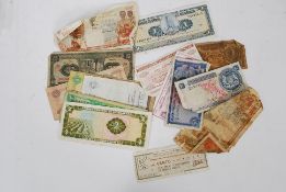A collection of vintage bank notes to  include greek, Malaysia, Nicaragua, Singapore, Ecuador,