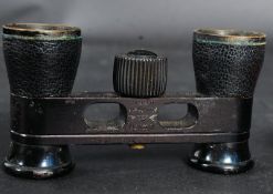 A vintage cased set of opera glasses, within an original red case.