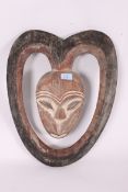 A 20th century African tribal wooden mask of wall hanging form ( see online illustration ) 0