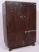A vintage wooden Carpenters workshop cabinet, Original condition with inner shelves/ fixings.