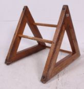A rare 1950's gymnasium school push up stepper having wooden supports united by steppers