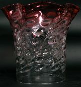 A good large cranberry and clear glass oil lamp shaped with scalloped cranberry glass top.