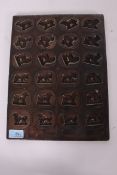 A stunning early 20th century copper and tinned chocolate mould of German origin bearing incised