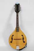 An 8 string madolin by Fransiscan, with mother or pearl inlaid ebonised fretboard,
