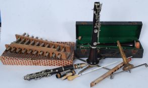 A cased Brevette Clarinet along with another unamed Clarinet with two Clarinet music stands