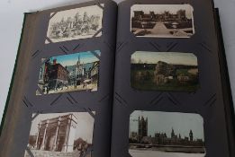 A decorative Edwardian postcard album filled with postcards relating to London and surround suburbs,