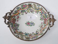 An 18th century French porcelain bowl / dish having ormulu metal embellished rim and pierced
