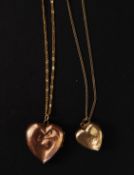 2x yellow metal (marked ' 375 ' indicating 9ct gold ) heart shaped pendant lockets, on chains.