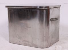 A 1930's art deco stainless steel coal box/ bucket having shaped front with lined interior.