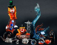 A Murano glass clown and ashtray together with a collection of art glass along with paperweights,