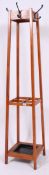 A 1950's school / industrial vintage squared base teak hook / coat rack and umbrella stand,