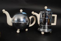 A retro 1930's Heatmaster ceramic and metal cover teapot complete with the spout stopper together