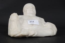 A good Chinese polished white veined Chinse marble seated figurine of Buddha