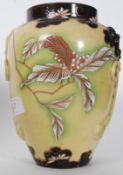 A 19th century majolica glazed vase of bulbous form with embellished decoration. Unmarked. 19.