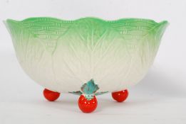 A Beswick leaf design salad bowl decorated with tomatoes bearing marks  to the base and raised on