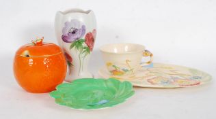 An Art Deco Brentleigh ware pottery tennis set together with a Beswick 207 orange shaped conserve