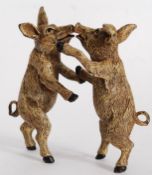 An Austrian style cold painted bronze statue of two kissing piglets.