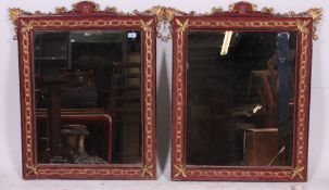 A pair of red laquered and gilded Chinese mirrors having fabulous shaped frames with gilded