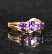 A 9ct gold amethyst and diamond ring. 2.8g.