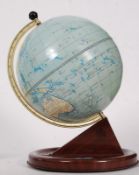 A 1950s Chad Valley tinplate terrestrial globe on simulated rosewood base.