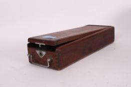 A vintage blood pressure machine sphygmomanometer within the original wooden case with makers