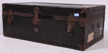 A 20th century vintage steamer trunk having hinged top and exterior metal corners together with 2