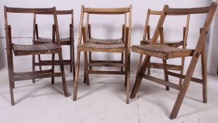 A collection of 6 mid 20th century wooden slatted village hall folding chairs to also include 1 x